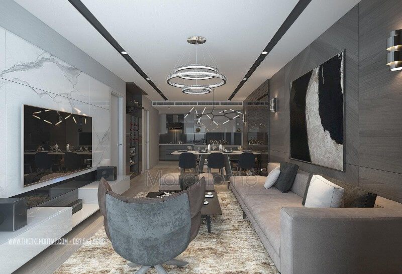 Không gian phòng khách được bố trí khoa học với chiếc sofa da chữ I kết hợp cùng chiếc đôn sofa, ghế sofa bọc da màu nâu